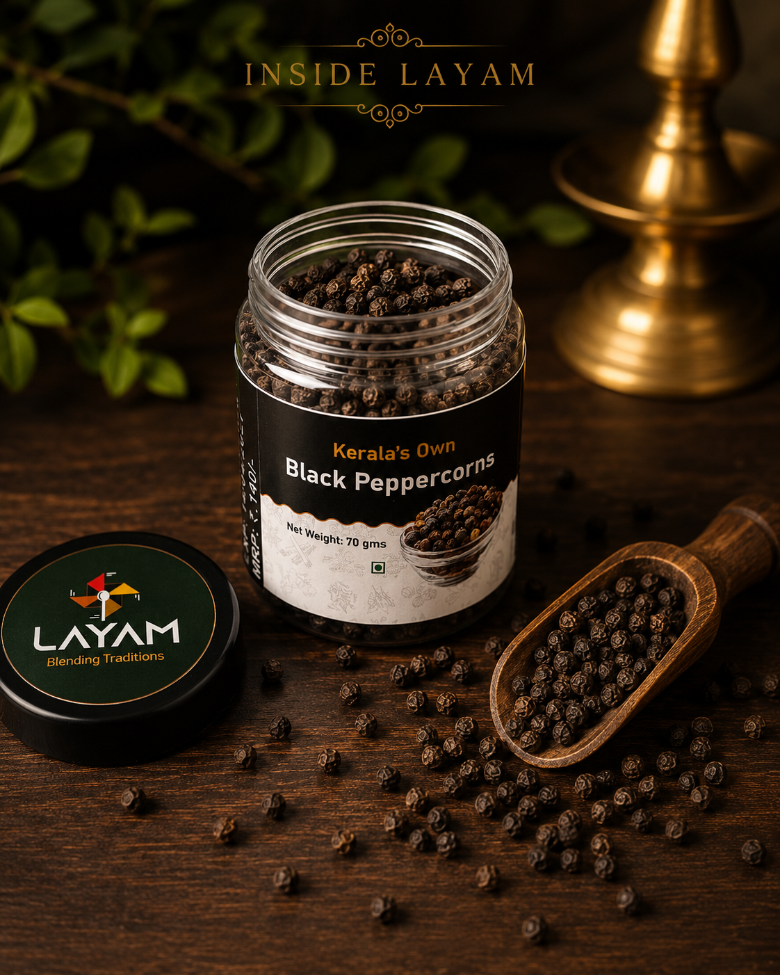 Open LAYAM black peppercorns jar showing whole peppercorns inside, with a wooden scoop