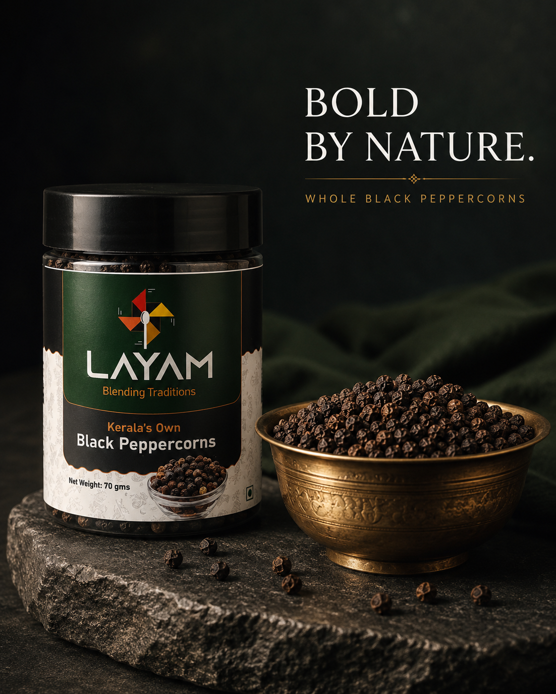 Bold by nature — whole black peppercorns, the LAYAM jar on stone with a brass bowl