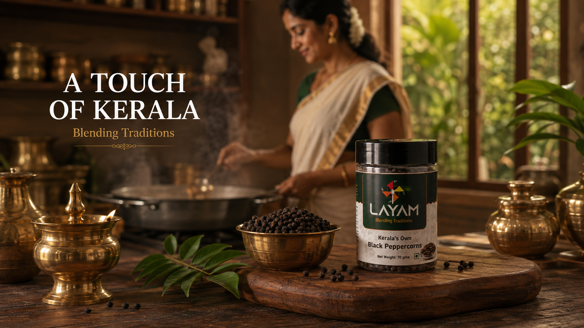 LAYAM black peppercorns jar in a traditional Kerala kitchen with brass vessels and a lit lamp