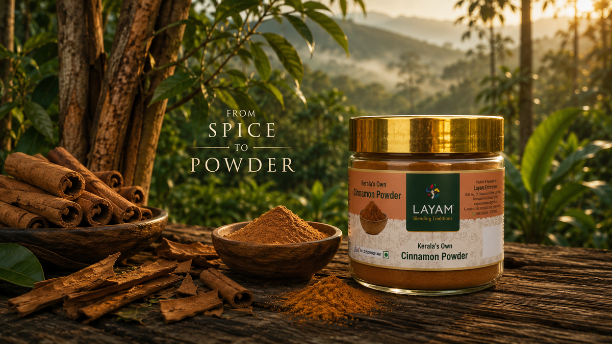 From spice to powder — LAYAM cinnamon powder jar beside cinnamon bark and quills, overlooking the Kerala hills
