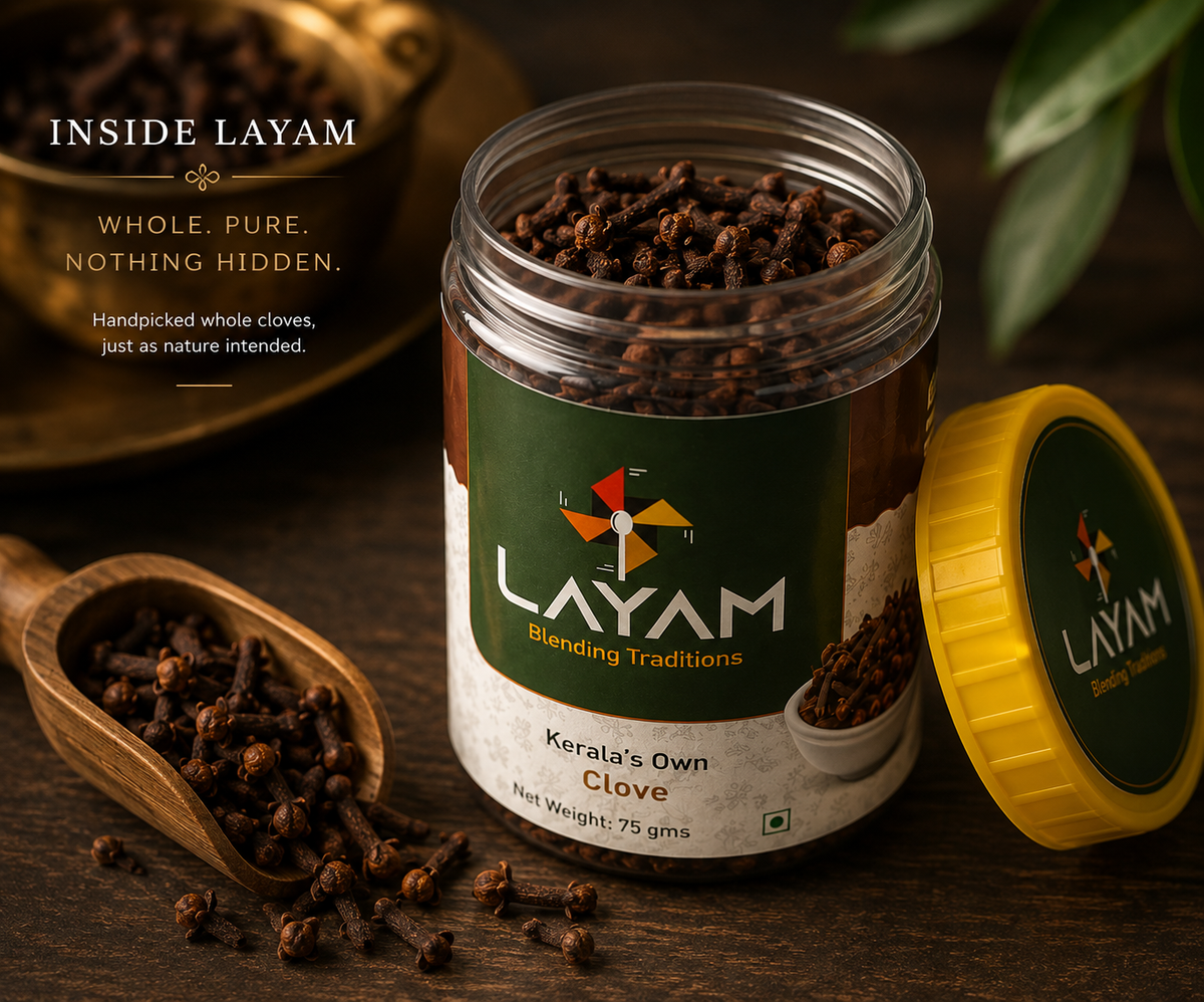 Open LAYAM clove jar showing whole unbroken cloves inside, with a wooden scoop