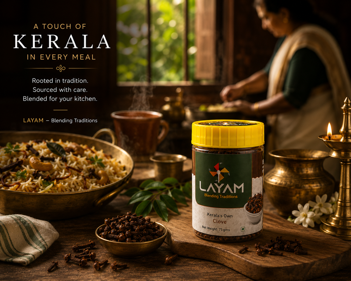 LAYAM clove jar in a Kerala kitchen beside clove biryani, brass vessels and a lit lamp