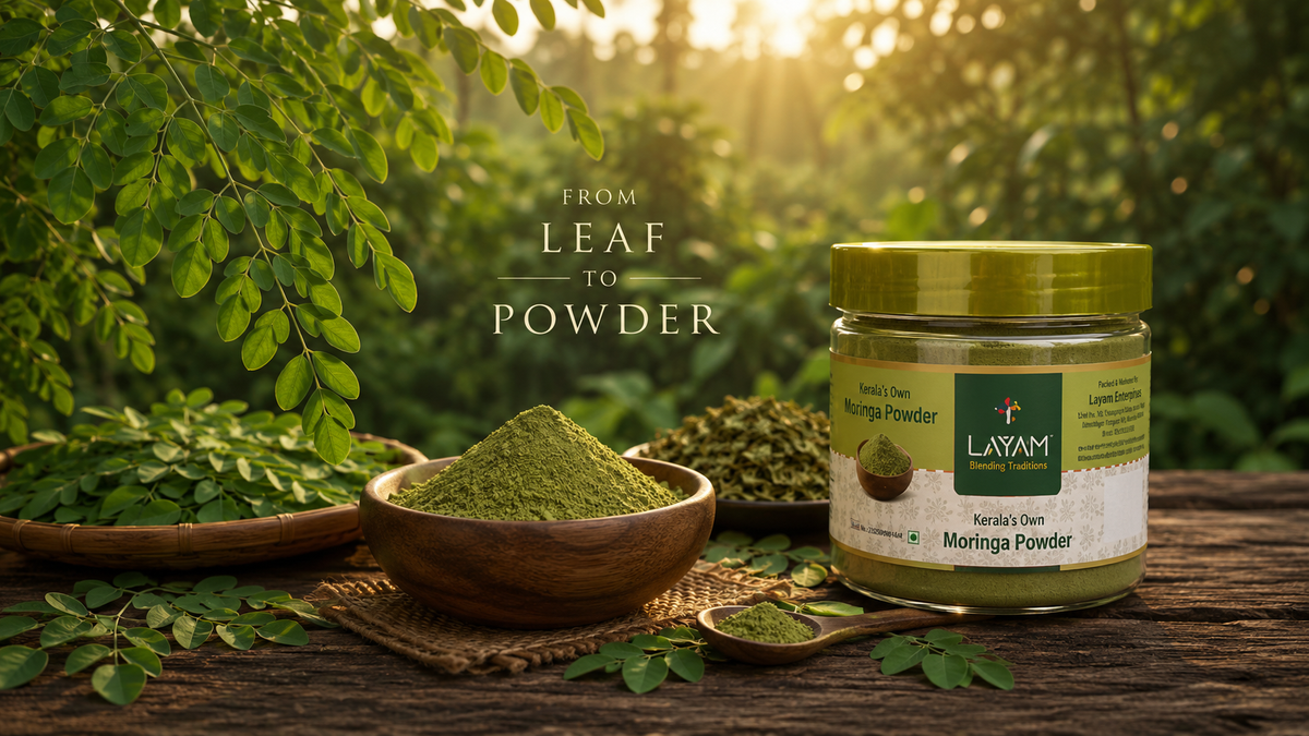 From leaf to powder — LAYAM moringa powder jar beside fresh and dried moringa leaves in a Kerala garden