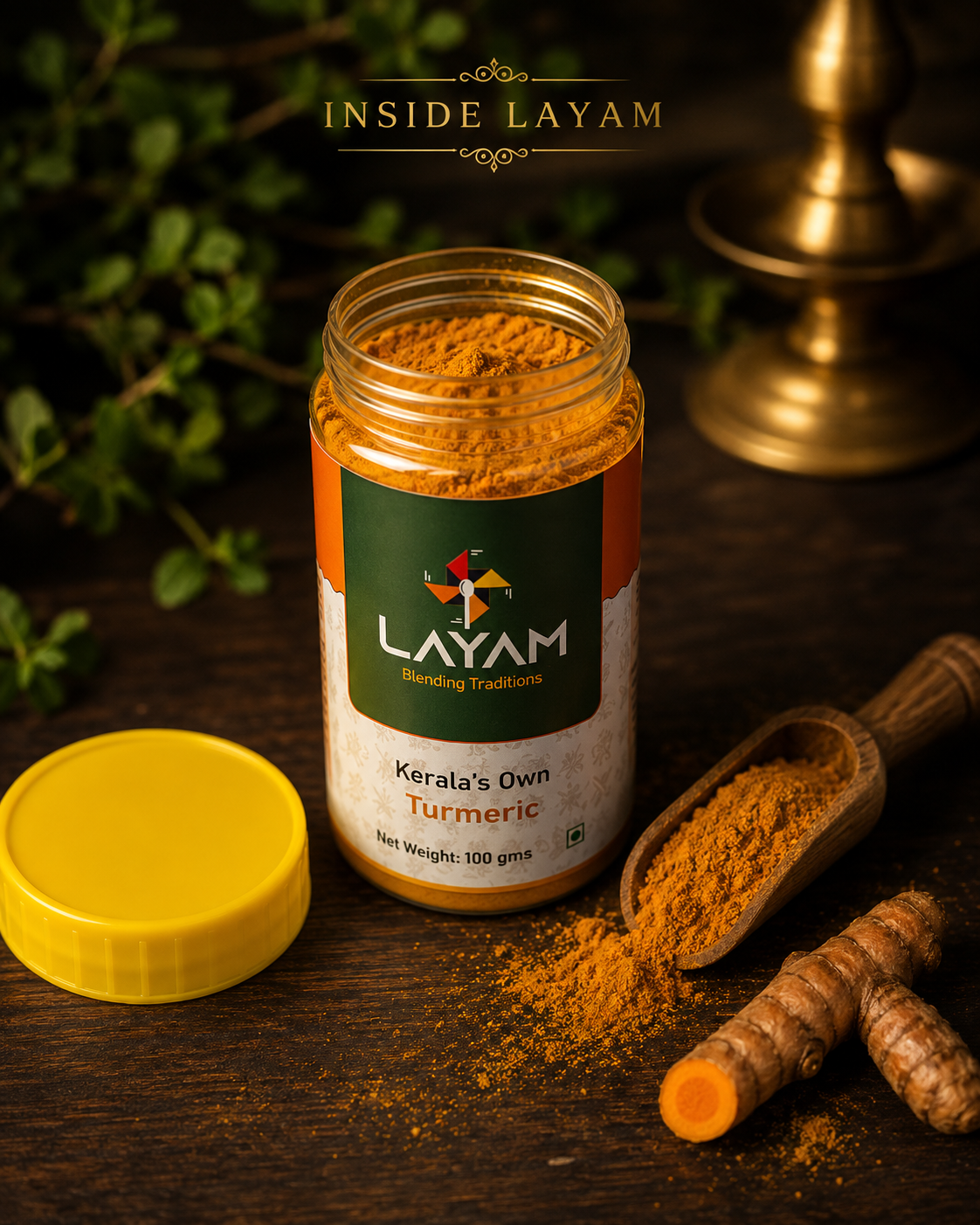 Open LAYAM turmeric jar showing fine golden powder inside, with a wooden scoop and fresh rhizomes