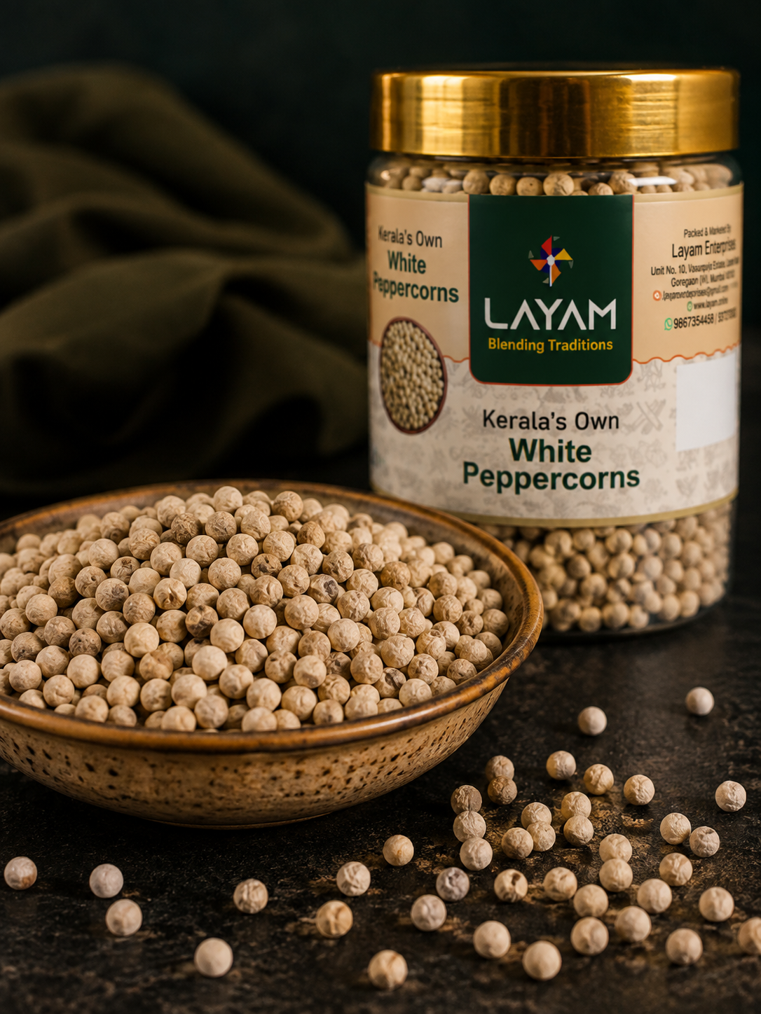 Close-up of LAYAM white peppercorns in a bowl beside the jar